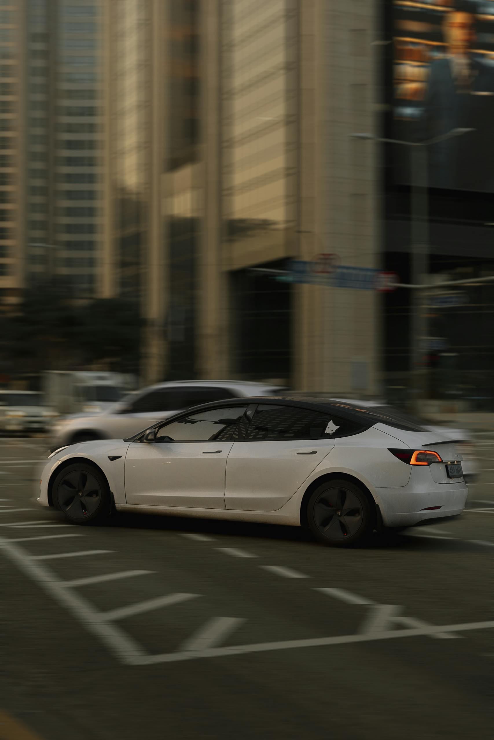 White Tesla Model 3 on Street in City