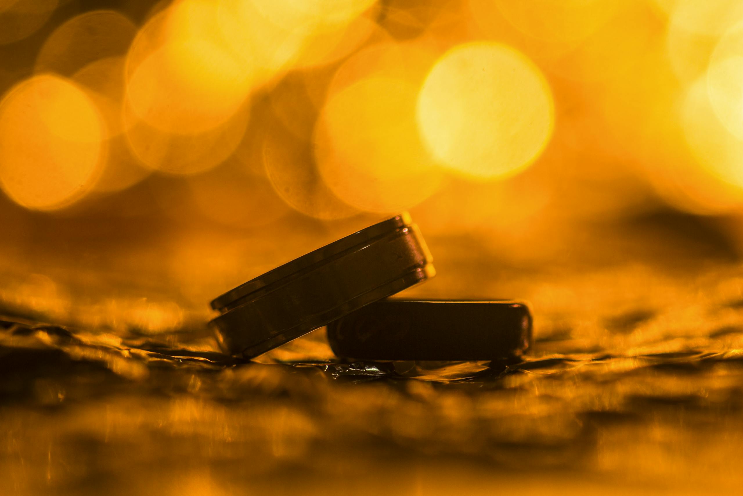 Pair of Silver Wedding Rings in Shallow Focus Photography